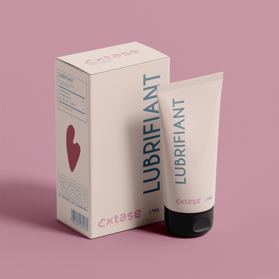 Packaging lubrifiant Extase Lovestore – tube et boîte rose poudrée avec icône cœur, typographie minimaliste sur fond rose